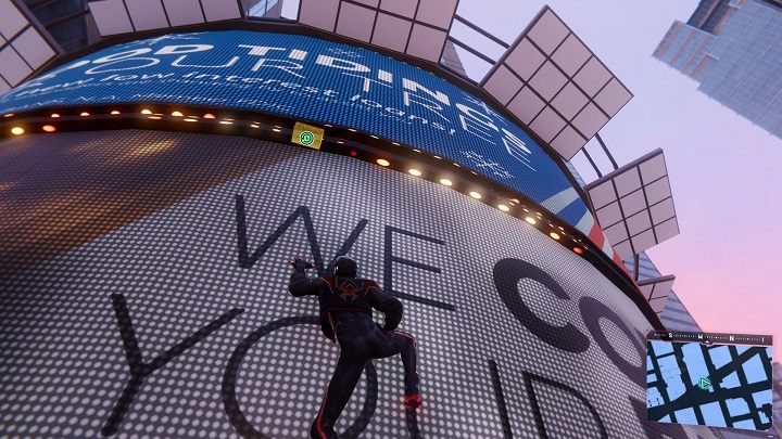 The first capsule in Midtown is located in the western part of the district, between the screens on the building - Spider-Man Miles Morales: Time capsules - all locations, list - Collectibles - Spider-Man Miles Morales Guide