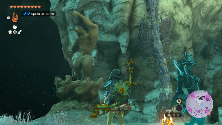 The face and left hand of the statue point the way in which you must go to find the next statue - Zelda TotK: A Mystery in the Depths - Walkthrough - Zelda Tears of the Kingdom Guide